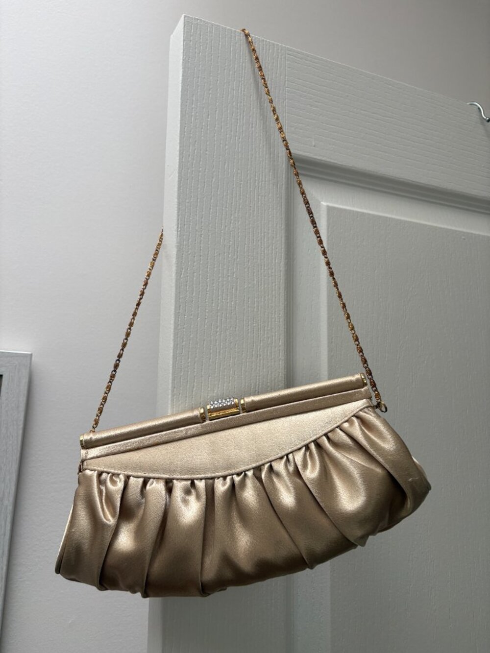 Gold satiny fabric clutch with gold chain
